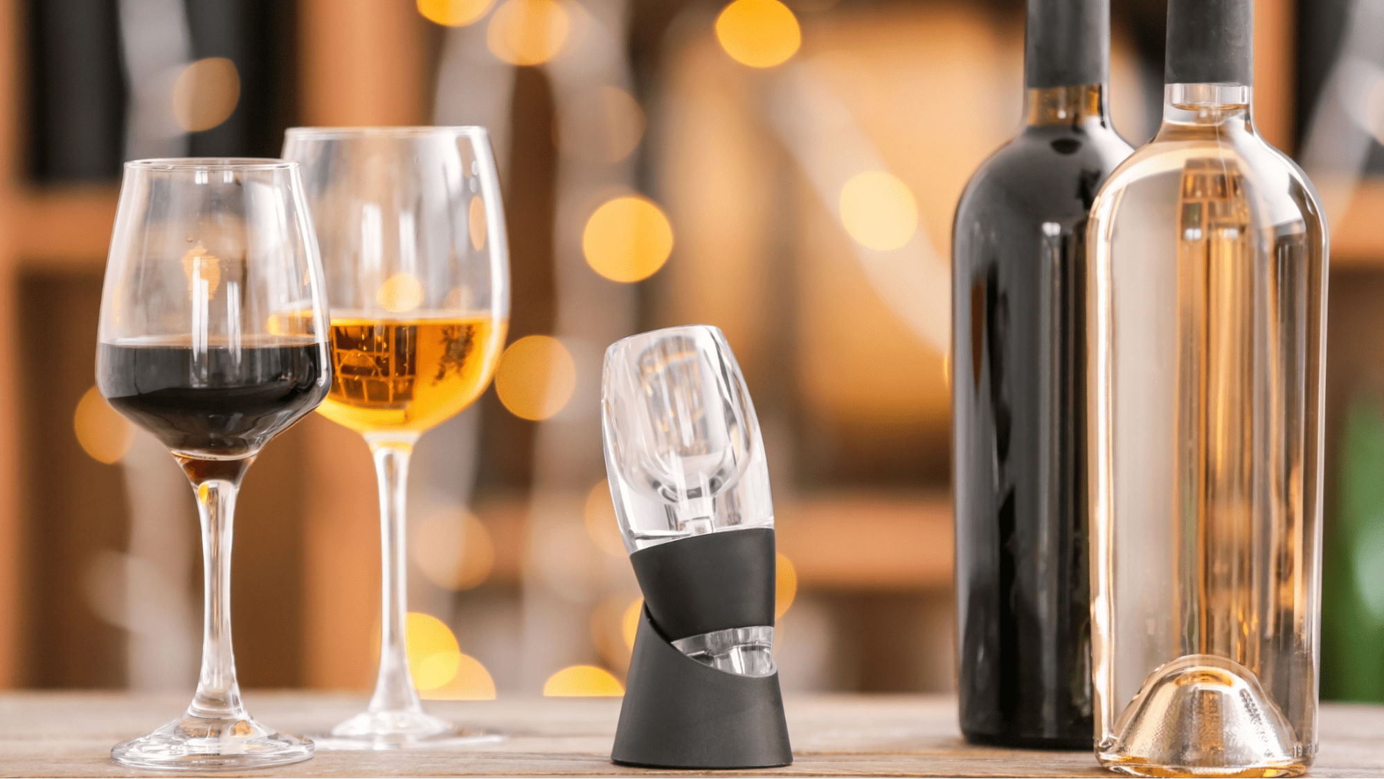 Glasses of red and white wine with an aerator